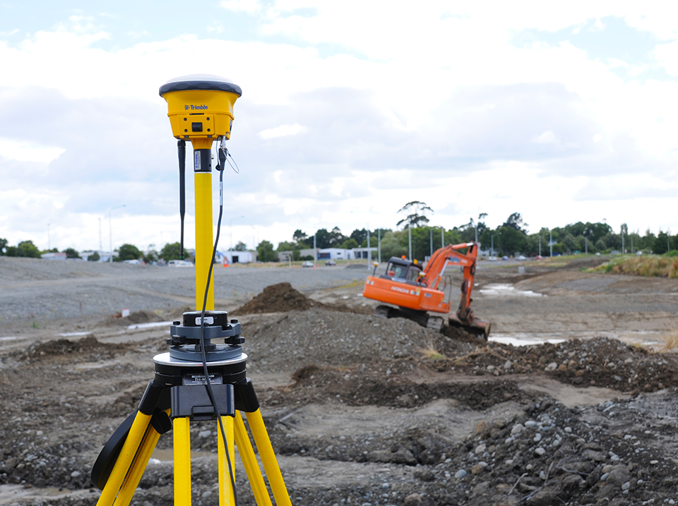 Trimble SPS986 GNSS Smart Antenna set up on a construction site. Site Positioning Software: Top Features to Look for